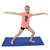 Child Yoga Posing on Blue Yoga Mat